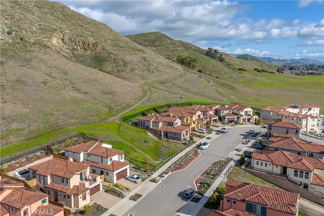 birds eye view of property featuring a mountain view