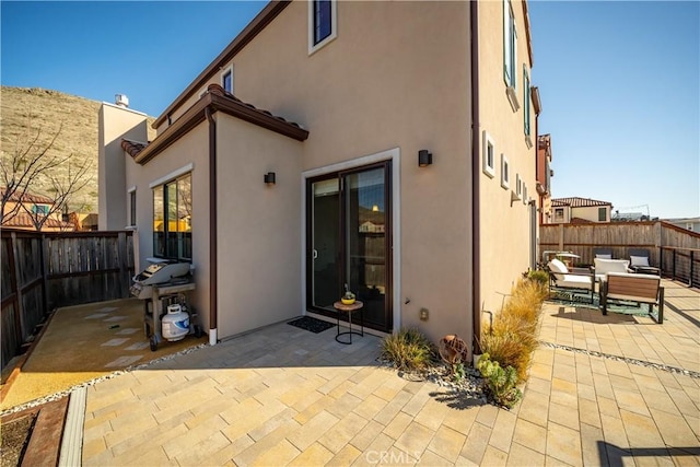 rear view of house featuring an outdoor hangout area and a patio area