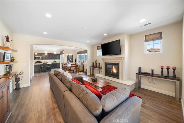 living room featuring dark hardwood / wood-style flooring and plenty of natural light