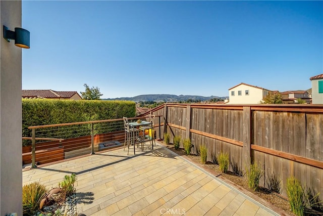 view of patio / terrace with a mountain view