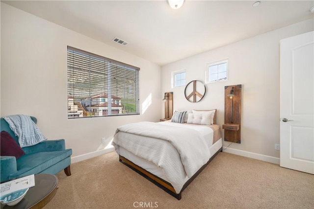 bedroom with light carpet