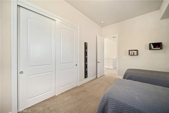 carpeted bedroom featuring a closet