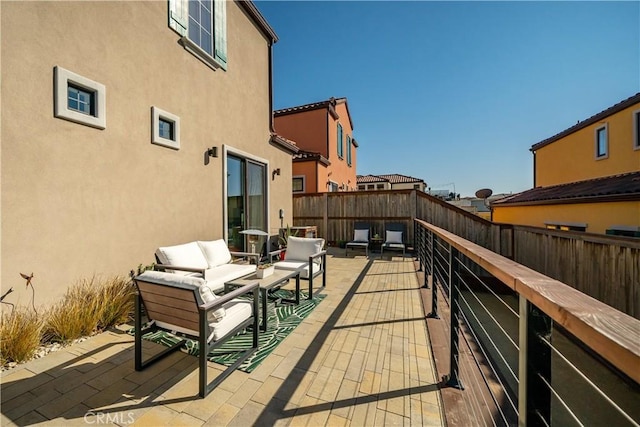 balcony with outdoor lounge area and a patio