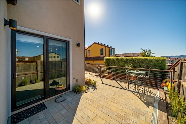 view of patio / terrace with a balcony