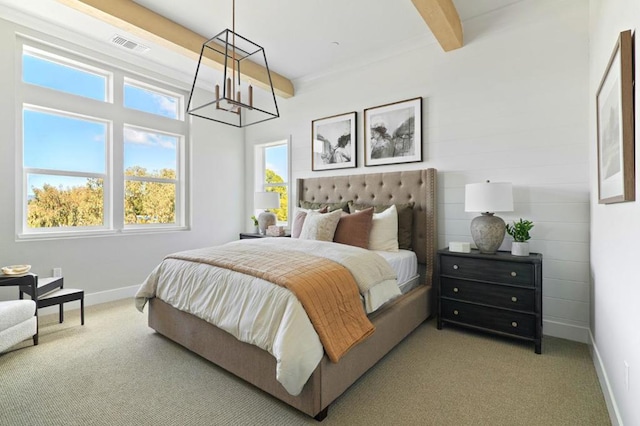 carpeted bedroom featuring beam ceiling