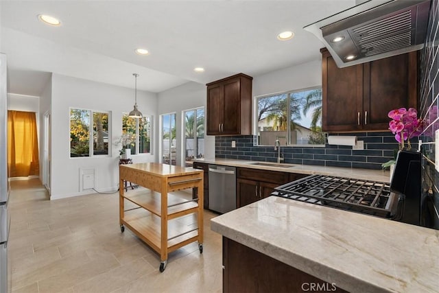 kitchen with dishwasher, backsplash, dark brown cabinets, a sink, and exhaust hood