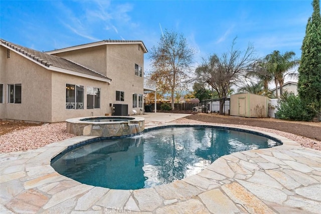 view of pool featuring an outbuilding, a patio area, a shed, cooling unit, and a fenced backyard