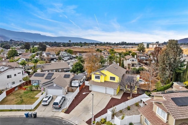 birds eye view of property featuring a mountain view and a residential view