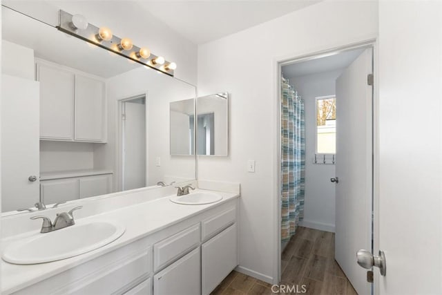 bathroom featuring vanity and hardwood / wood-style floors