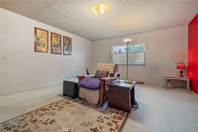 carpeted bedroom featuring a textured ceiling