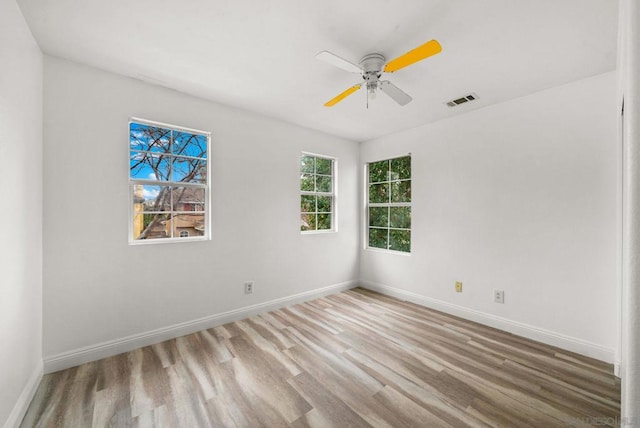 unfurnished room featuring ceiling fan and light hardwood / wood-style floors