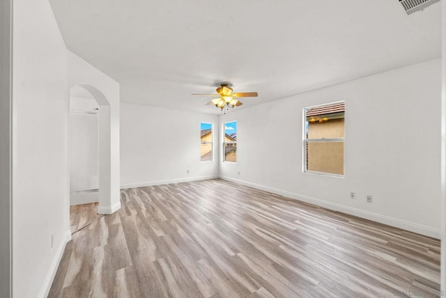 spare room featuring ceiling fan and light hardwood / wood-style floors