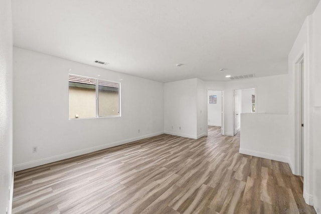 spare room with light hardwood / wood-style floors