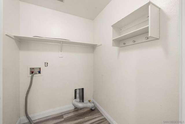 washroom with hookup for a washing machine and hardwood / wood-style floors