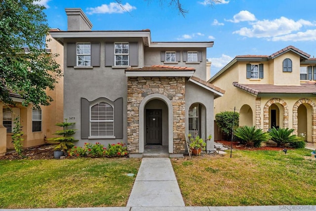 view of front of property featuring a front lawn