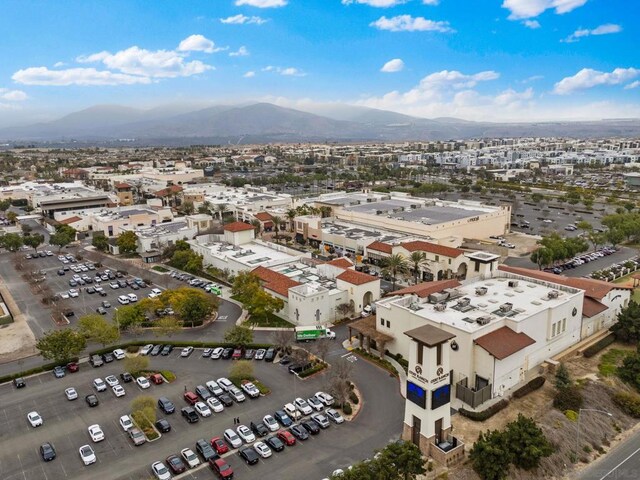 birds eye view of property with a mountain view