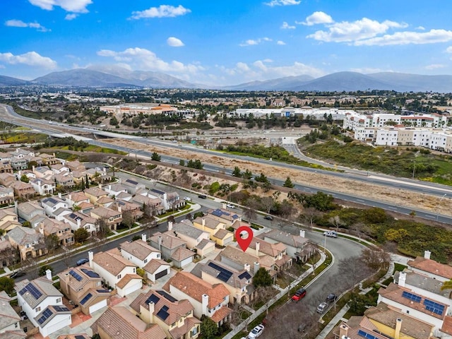 birds eye view of property with a mountain view