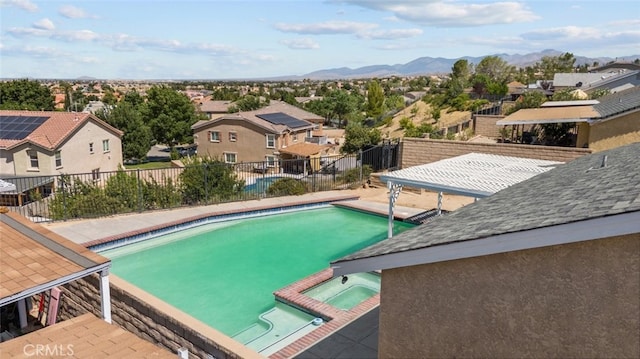 view of pool featuring a patio and a mountain view