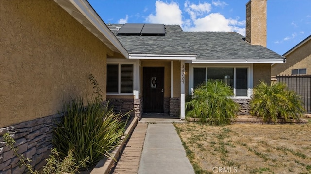 property entrance with solar panels