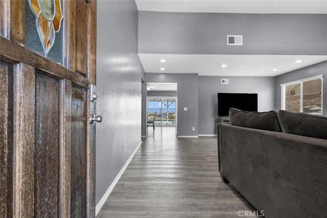 corridor with dark hardwood / wood-style floors