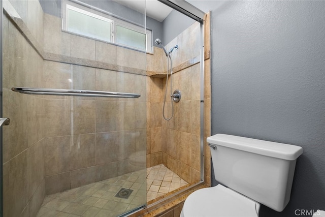 bathroom with walk in shower and toilet