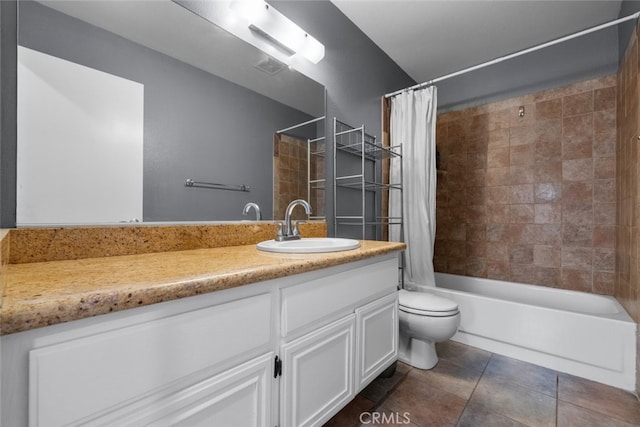 full bathroom featuring tile patterned flooring, vanity, toilet, and shower / bath combo with shower curtain