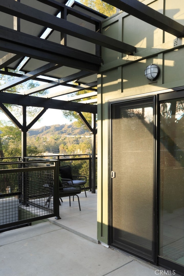 view of patio / terrace with a mountain view