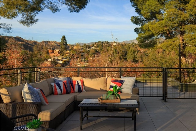 view of patio with a mountain view and outdoor lounge area