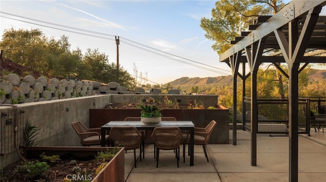 view of patio / terrace with a mountain view