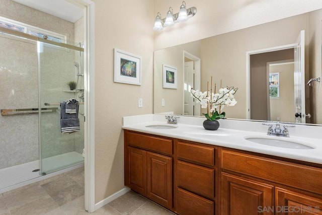 bathroom featuring vanity, toilet, and a shower with shower door