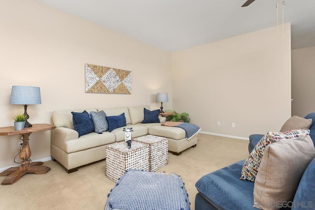 carpeted living room featuring ceiling fan