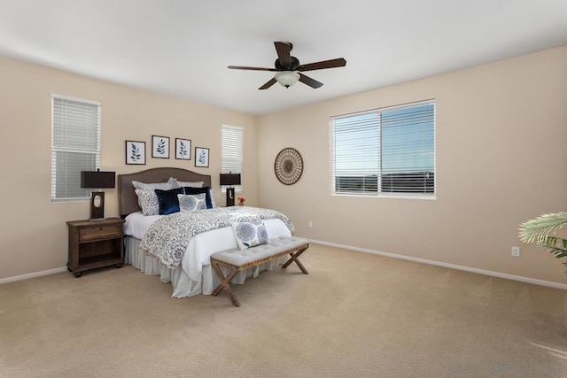 bedroom featuring light colored carpet and ceiling fan