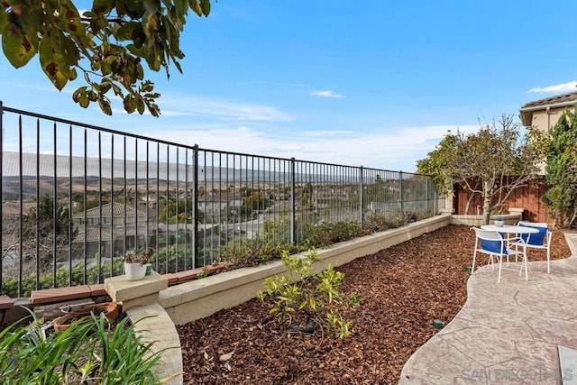 view of yard featuring a water view and a patio area