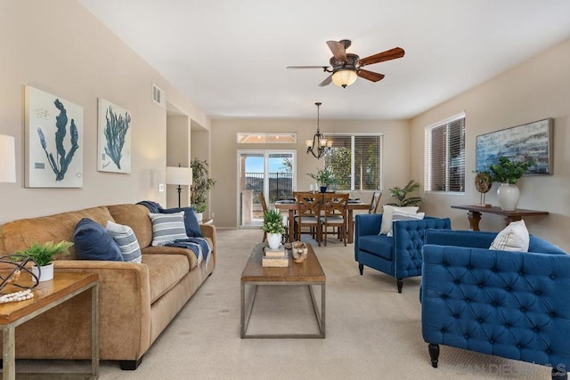 living room with light colored carpet and ceiling fan