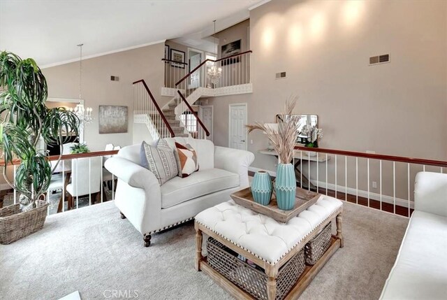 26481 Montebello Pl, Mission Viejo, CA 92691 - carpeted living area with stairway, high vaulted ceiling, a notable chandelier, and visible vents