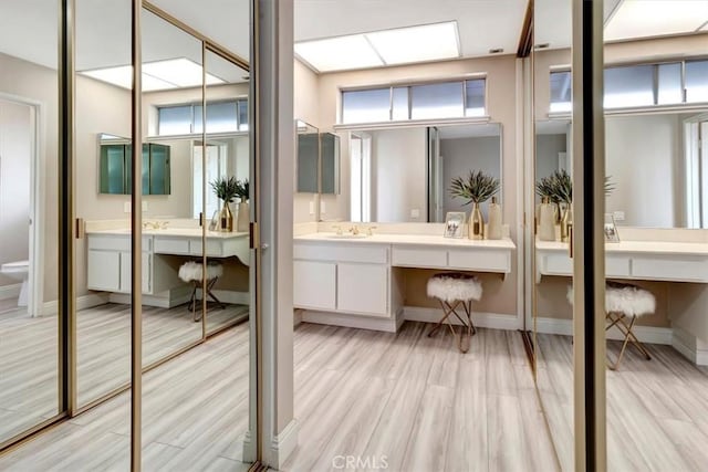 26481 Montebello Pl, Mission Viejo, CA 92691 - full bathroom with toilet, baseboards, wood finished floors, and vanity