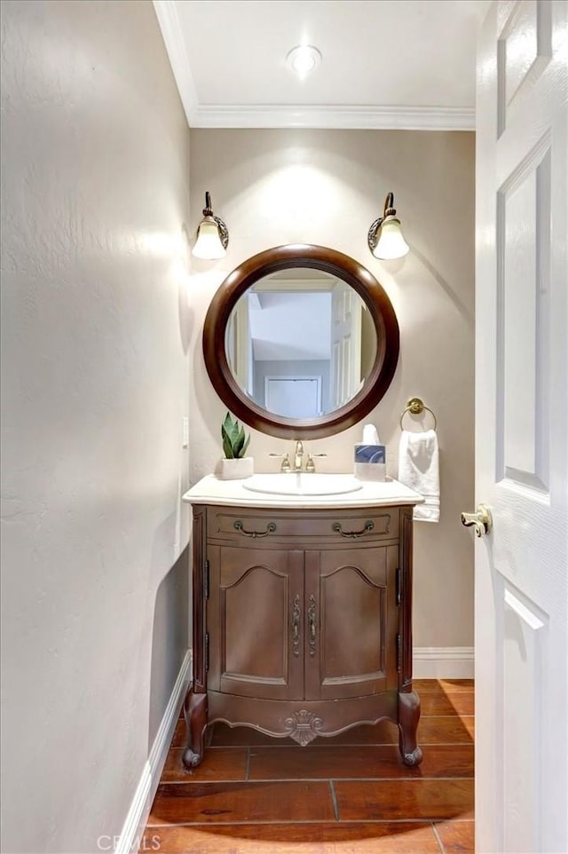 26481 Montebello Pl, Mission Viejo, CA 92691 - bathroom featuring crown molding, baseboards, wood finished floors, and vanity
