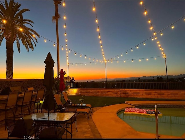 26481 Montebello Pl, Mission Viejo, CA 92691 - patio terrace at dusk with a fenced backyard