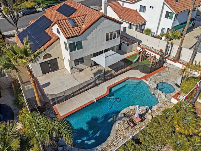 view of pool featuring an in ground hot tub