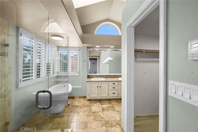 bathroom with vanity, vaulted ceiling, shower with separate bathtub, and a healthy amount of sunlight