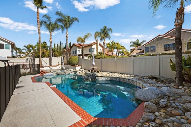 view of swimming pool with a patio