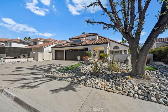 mediterranean / spanish-style house with a garage