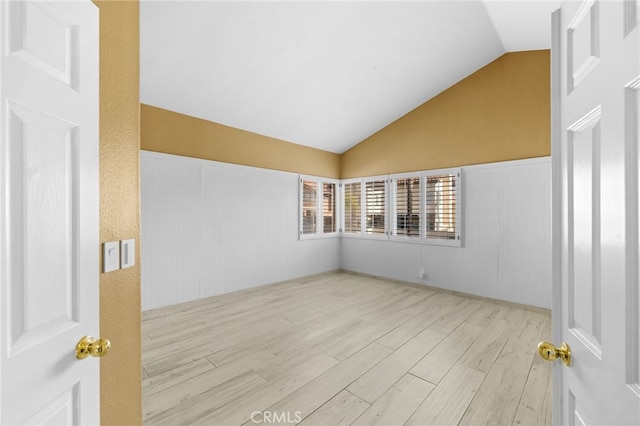 interior space featuring light hardwood / wood-style flooring and vaulted ceiling