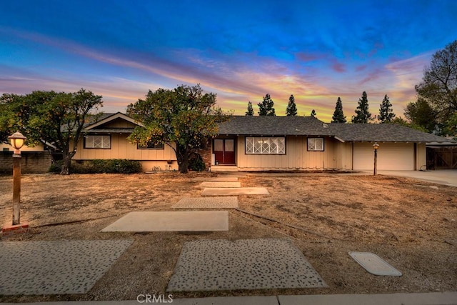 single story home featuring a garage