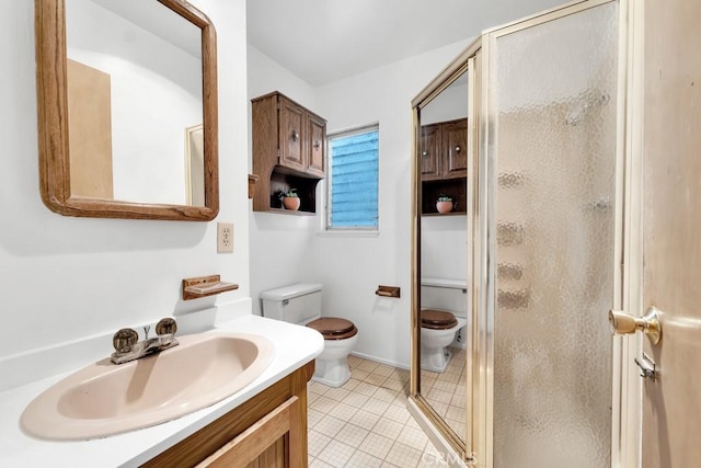 bathroom with vanity, toilet, an enclosed shower, and tile patterned flooring