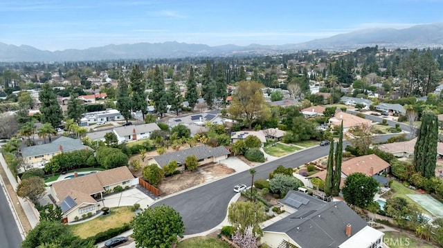 birds eye view of property with a mountain view