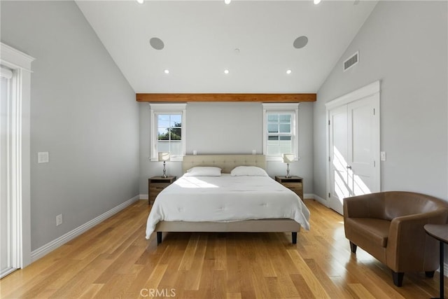 bedroom featuring high vaulted ceiling and light wood-type flooring