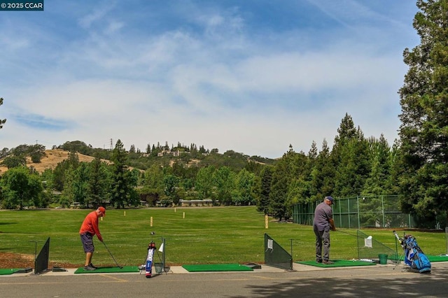 surrounding community featuring a yard