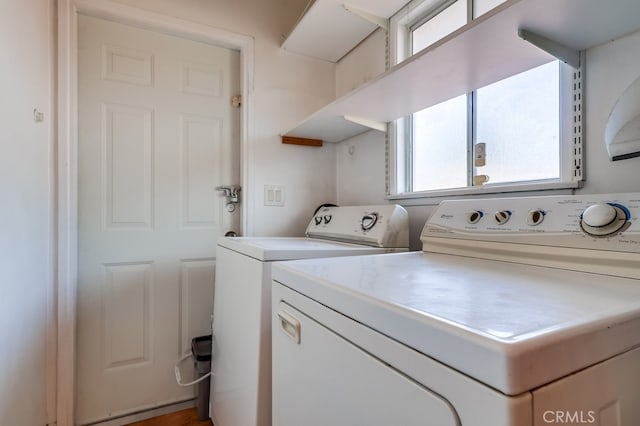 clothes washing area featuring washing machine and clothes dryer