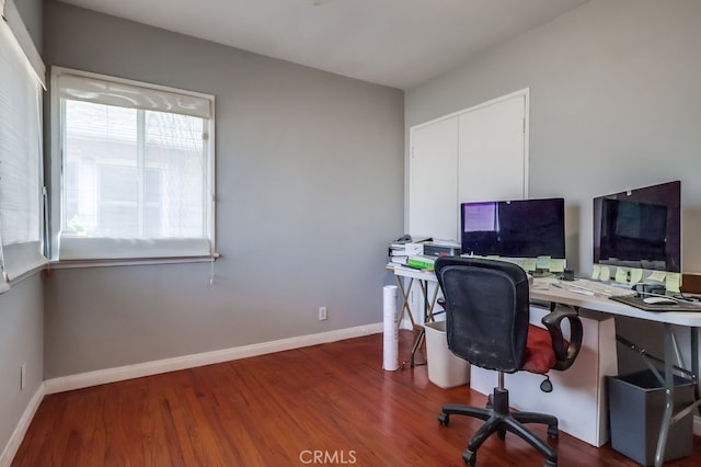 office space with dark hardwood / wood-style flooring